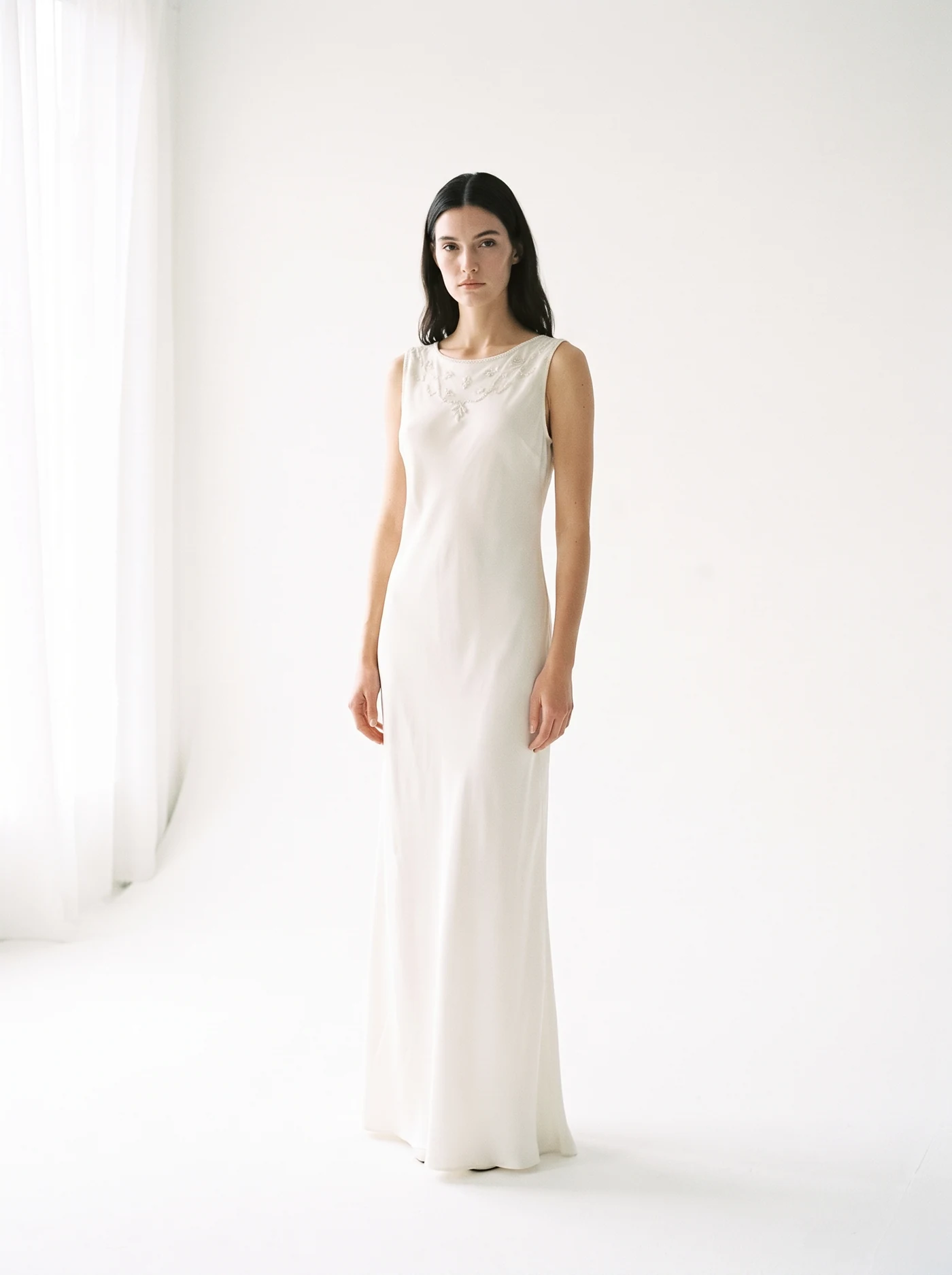 Silk column gown — Bias-cut ivory silk, beaded neckline