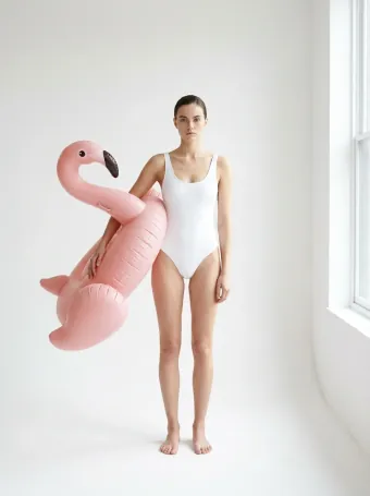 Inflatable flamingo — Held like a Birkin